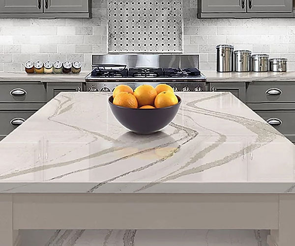 Marble Table Top with a bowl with oranges in them